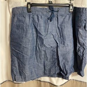 Jean mini skirt with elastic and drawstring waist, pockets, 18 inches long.